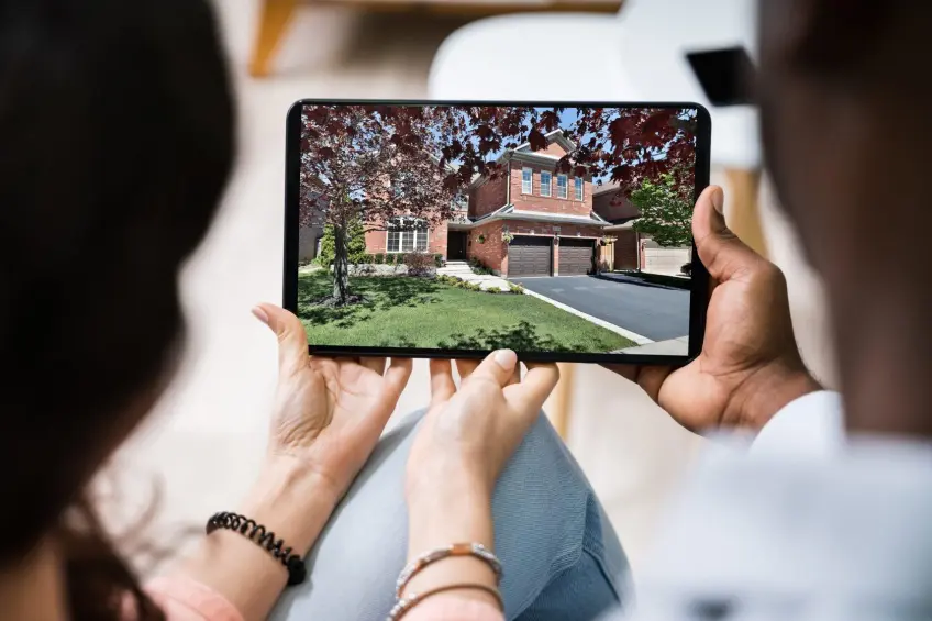 Couple looking at virtual open house on an iPad