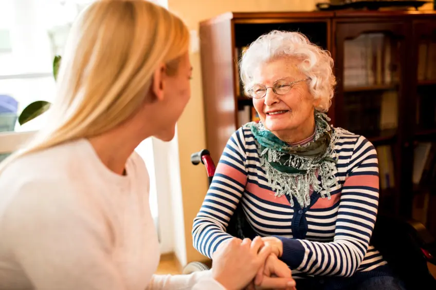 Elderly woman with adult daughter