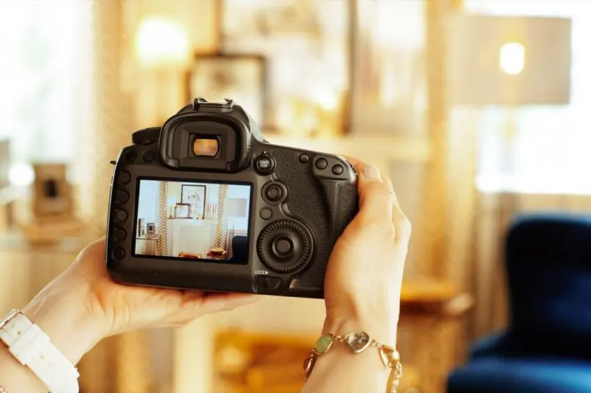 Real estate photographer taking interior photos