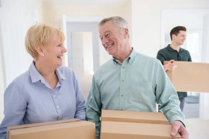 Senior couple downsizing their home to a small condo