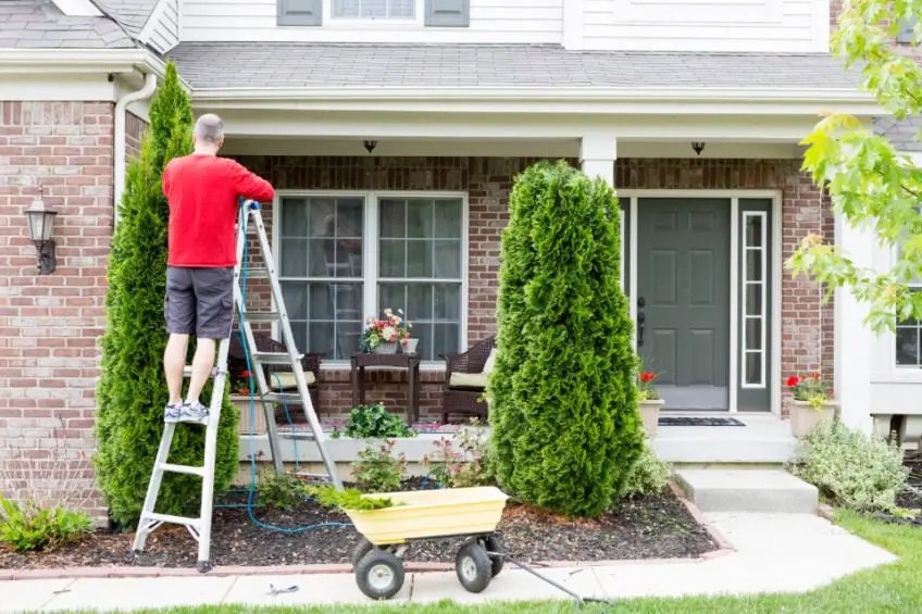 Man doing yard work in spring