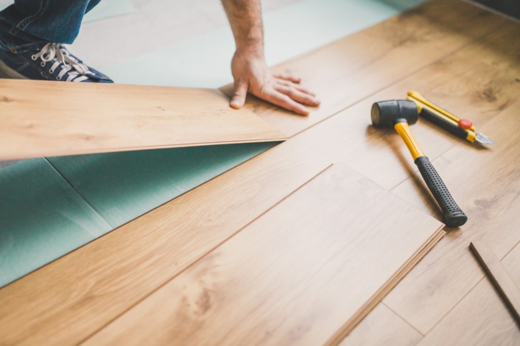 Installing flooring during home renovation