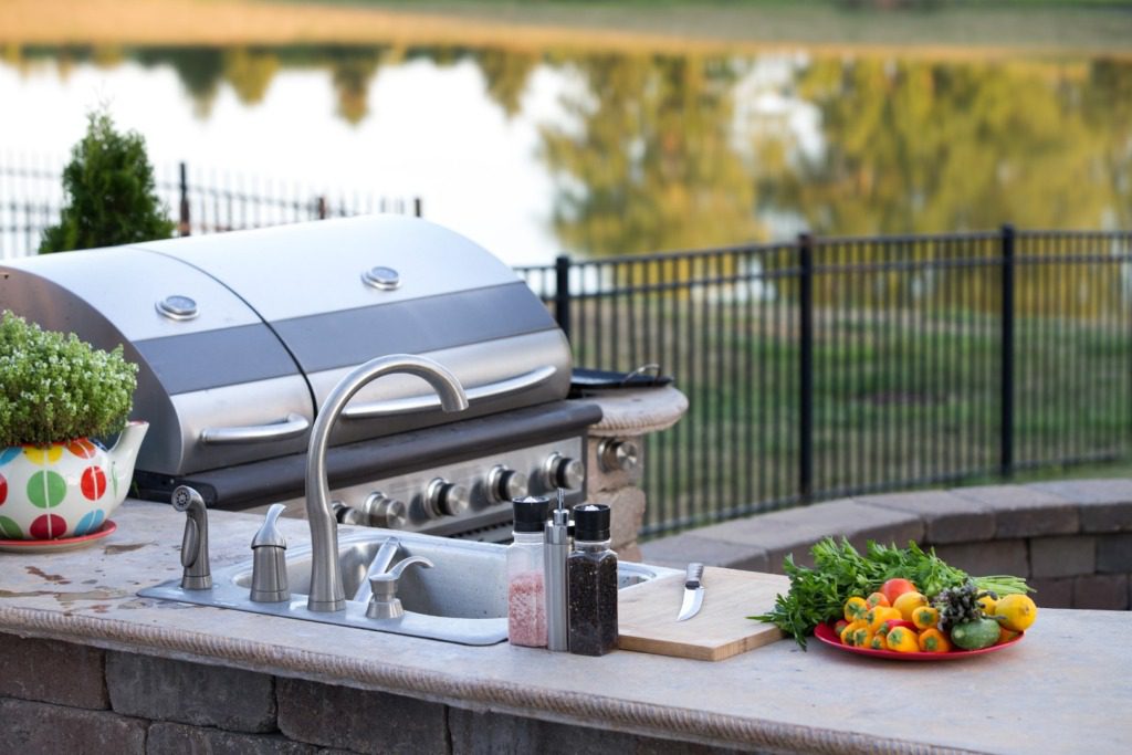 Outdoor kitchen with sink and barbecue