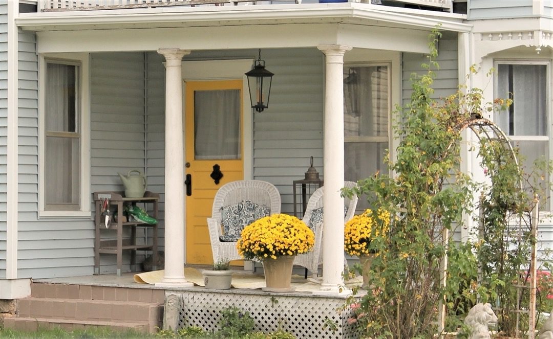 Yellow front door on home