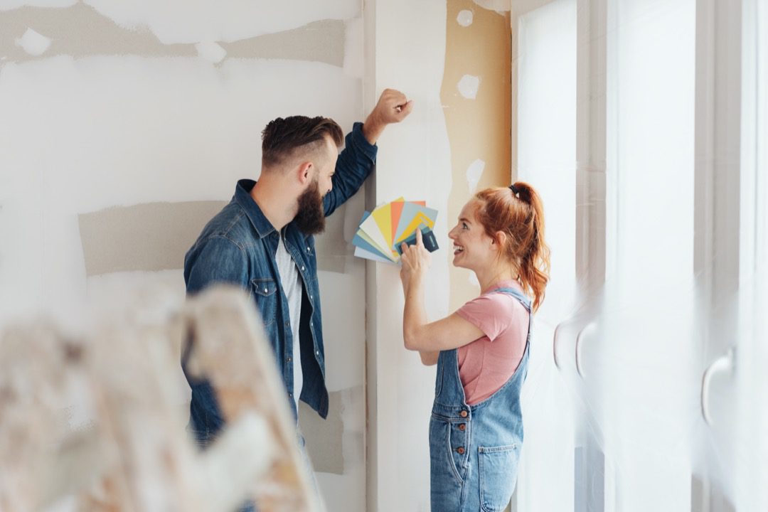 Couple discussing home improvements to boost their home's roi