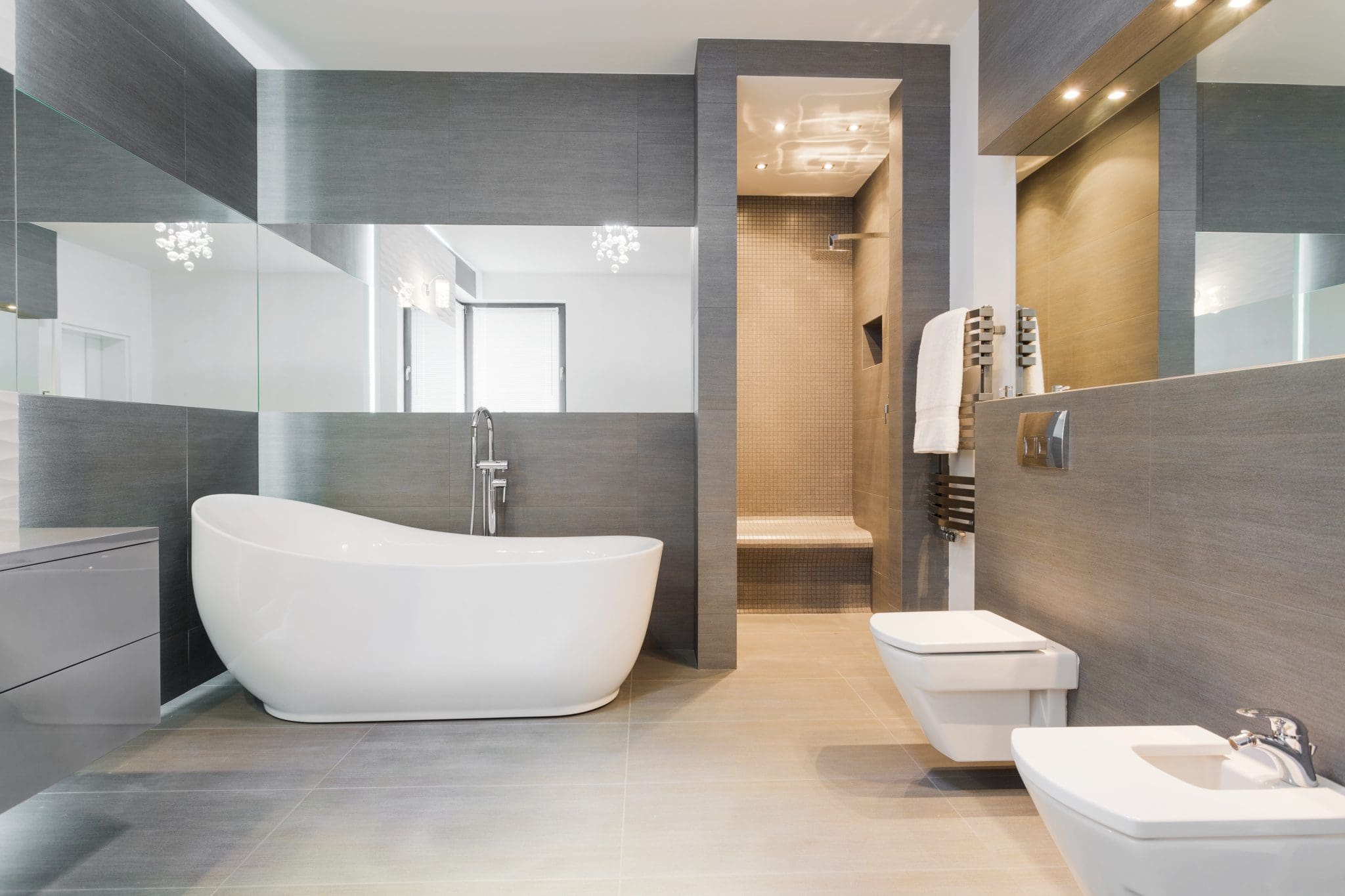 Freestanding bath in modern bathroom team logue